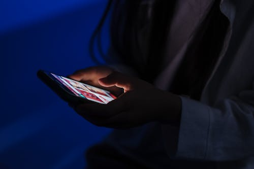 Person using a smartphone to browse social media platforms